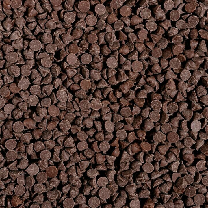 Vue du dessus sur une table des pistoles de chocolat noir, lait, blanc et lait-caramel